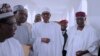 In this photo released by the Nigeria State House, Nigeria's President Muhammadu Buhari, center, with government officials after Friday prayers at the presidential palace in Abuja, Nigeria, May. 5, 2017. 