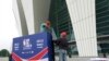 Workers dismantle signage for an NBA fan event that was scheduled to be held at the Shanghai Oriental Sports Center in Shanghai, China, Oct. 8, 2019.