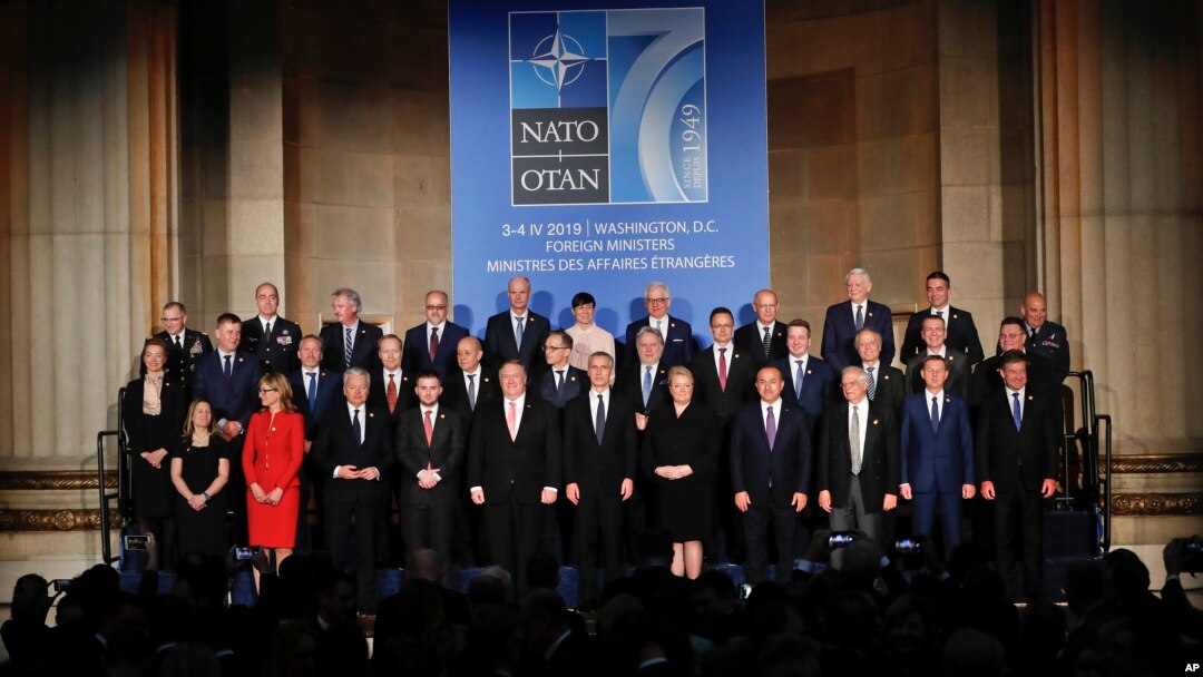 Foreign Ministers from NATO countries pose for a group photo during a ceremony to commemorate NATO's 70th anniversary at Mellon Auditorium in Washington, Wednesday, April 3, 2019. 