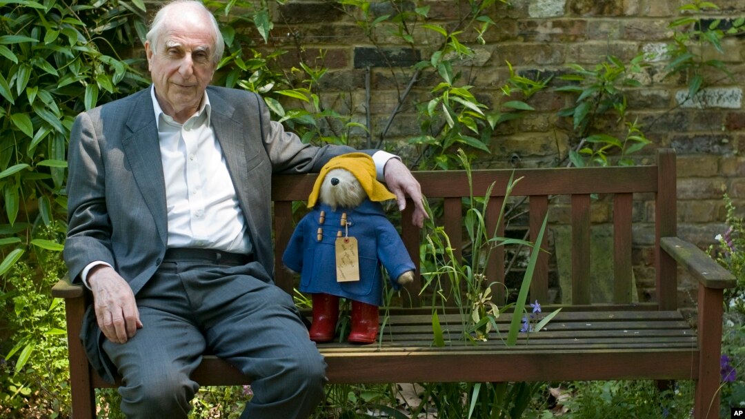 British author Michael Bond sits with a Paddington Bear toy during an interview with The Associated Press in London, June 5, 2008. 