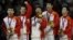 Feng Zhe (L-R) of China and teammates Guo Weiyang, Chen Yibing, Zhang Chenglong and Zou Kai celebrate with their gold medals after taking first place in the men's gymnastics team final in the North Greenwich Arena at the London 2012 Olympic Games, July 30