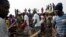 People sell clothes at the displaced camp at Mpoko international airport in Bangui, Central African Republic, Feb. 26, 2014.