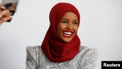 Fashion model and former refugee Halima Aden has her makeup applied during a shoot at a studio in New York City, Aug. 28, 2017.