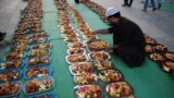 Pakistani Muslim man prepares Iftar food for Muslim devotees to break their fast during Muslim fasting month of Ramadan in Karachi.