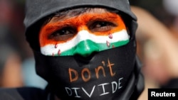 A demonstrator attends a protest against riots following clashes between people demonstrating for and against a new citizenship law in New Delhi, March 3, 2020.