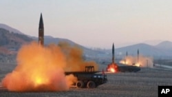 FILE - In this file image made from video released by KRT on March 7, 2017, North Korea launches four missiles in an undisclosed location North Korea.