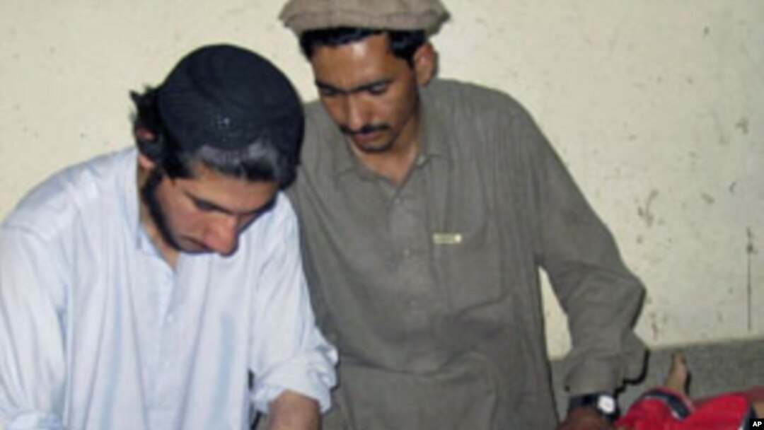 A girl, who was wounded in a bomb blast at a restaurant, receives treatment at a hospital in Miranshah, near the Afghan border. A blast at a restaurant in Pakistan's tribal North Waziristan region near the Afghan border wounded 10 people, May 30, 2011