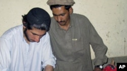 A girl, who was wounded in a bomb blast at a restaurant, receives treatment at a hospital in Miranshah, near the Afghan border. A blast at a restaurant in Pakistan's tribal North Waziristan region near the Afghan border wounded 10 people, May 30, 2011