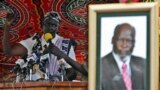 FILE - Rebecca Nyandeng, the widow of late former rebel Sudan People's Liberation Movement leader John Garang, addresses mourners during the funeral service in Juba, August 6, 2005.