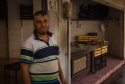 Mohammad, 39, sent his three children to stay with relatives ahead of the end of the cease-fire, but says he won't leave unless the city is bombed, in Darbasiyah, Syria, Oct. 22, 2019. (VOA/Yan Boechat)