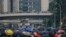 Protesters shield behind umbrellas as they prepare to face off with police in Hong Kong, Sept. 29, 2019. 