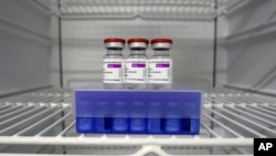 FILE - In this Monday, March 22, 2021 file photo, AstraZeneca and Biontech coronavirus vaccine in a fridge at the vaccine center in Ebersberg near Munich, Germany. AstraZeneca’s release of encouraging data about its coronavirus vaccine from its U.S…