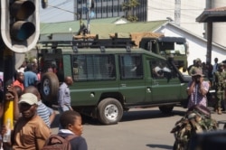 Military vehicles and soldiers were used to block the Presidential Way in Lilongwe, Malawi, July 25, 2019, to prevent the protesters from delivering petitions calling for Jane Ansah to resign as MEC chairwoman. (VOA/L. Masina)