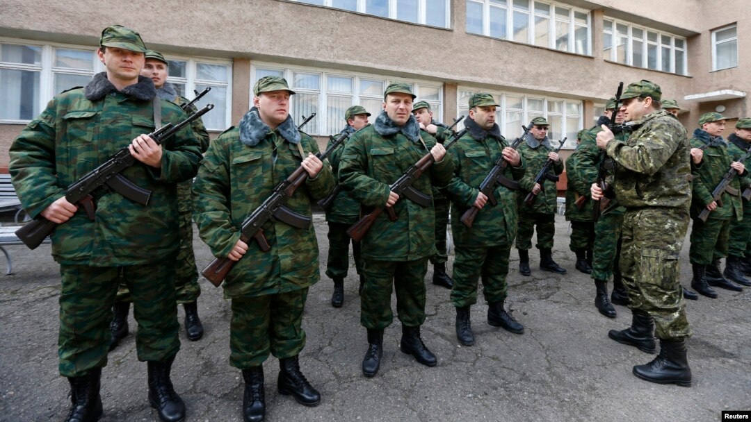 Members of a pro-Russian self-defense unit stand in formation as they ready to swear an oath to the pro-Russia Crimea regional government in Simferopol, March 13, 2014.
