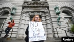 FILE - Beth Kohn protests against U.S. President Donald Trump's executive order outside the 9th U.S. Circuit Court of Appeals courthouse in San Francisco, California, Feb. 7, 2017.