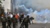 VENEZUELA -- Opposition demonstrators clash with security forces during a protest against the government of President Nicolas Maduro on the anniversary of the 1958 uprising that overthrew the military dictatorship, in Caracas on January 23, 2019.