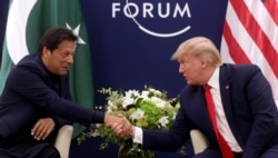 FILE - President Donald Trump shakes hands with Pakistan's Prime Minister Imran Khan during a bilateral meeting at the 50th World Economic Forum annual meeting in Davos, Switzerland, Jan. 21, 2020.