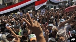 Anti-government protesters shout slogans and gesture during a demonstration demanding the resignation of Yemeni President Ali Abdullah Saleh, in Sana'a, Yemen, February 26, 2011