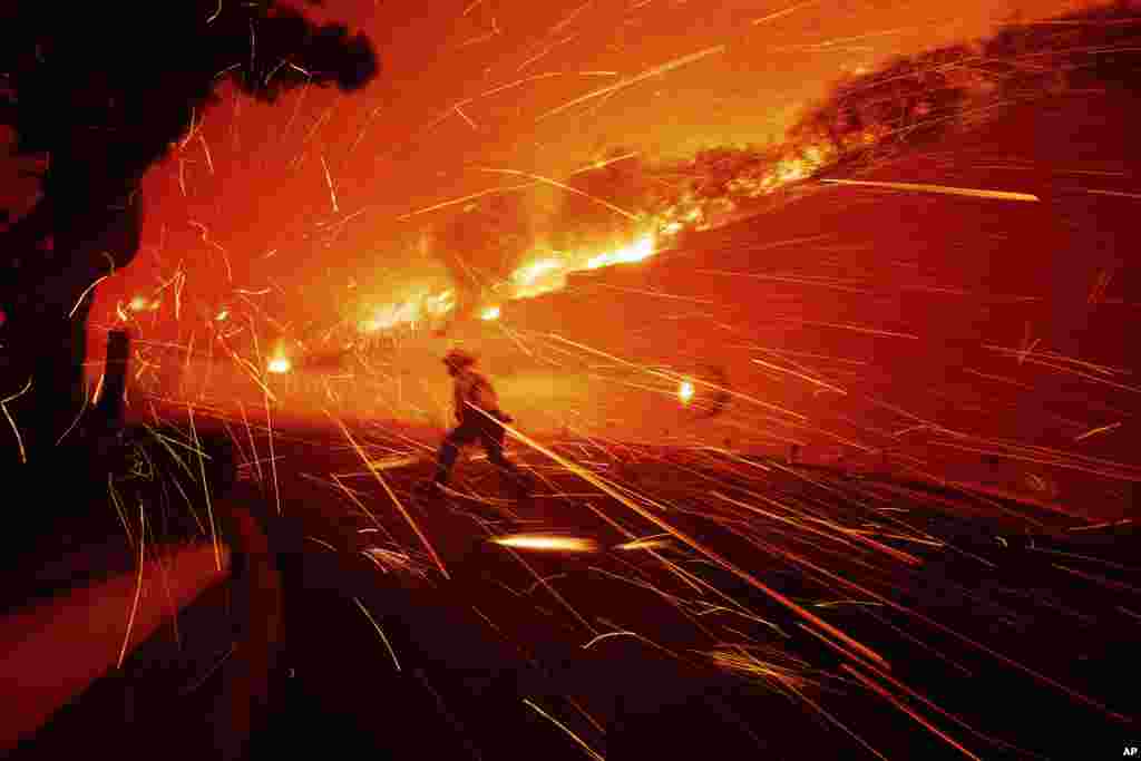 Firefighters battle the Franklin Fire in Malibu, California.&nbsp;Thousands of Southern California residents are under evacuation orders and warnings as firefighters battle a wind-driven wildfire in Malibu. The flames burned near seaside mansions and Pepperdine University, where students sheltering at the school&rsquo;s library watched as the blaze intensified. (AP Photo/Ethan Swope)