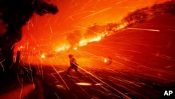 Firefighters battle the Franklin Fire in Malibu, California.&nbsp;Thousands of Southern California residents are under evacuation orders and warnings as firefighters battle a wind-driven wildfire in Malibu. The flames burned near seaside mansions and Pepperdine University, where students sheltering at the school&rsquo;s library watched as the blaze intensified. (AP Photo/Ethan Swope)