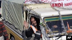 A Kashmiri driver waves as he leaves to Pakistan Administered Kashmir during cross-border trade at Salamabad, 107 km (66 miles) west of Srinagar (2008 file photo)