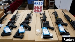 FILE - AR-15 rifles are displayed for sale at a gun show in Pennsylvania, Oct. 6, 2017. 