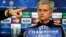 Chelsea's manager Jose Mourinho looks on as the press officer points to a member of the media during a press conference at Stamford Bridge in London, Monday, March 17, 2014. Galatasaray will play Chelsea on Tuesday in their Champions League round of 16 se