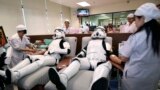 Udomsak Ratanotayo (l) and Suttinan Boonsomkiat wear storm trooper costumes while donating blood at the Thai Red Cross in Bangkok, Thailand. Thai Star Wars fans will donate blood and give toys at an orphanage as part of a promotional campaign.