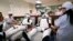 Udomsak Ratanotayo (l) and Suttinan Boonsomkiat wear storm trooper costumes while donating blood at the Thai Red Cross in Bangkok, Thailand. Thai Star Wars fans will donate blood and give toys at an orphanage as part of a promotional campaign.