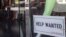 A help wanted sign is posted on the front window of a clothing boutique in Los Angeles, December 7, 2012.