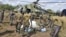 Ugandan soldiers, who are tracking down Lord's Resistance Army (LRA) fugitive leaders, load supplies off a military helicopter in a forest bordering Central African Republic, South Sudan and Democratic Republic of Congo, near river Chinko, April 18, 2012.