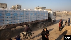 People ticker  arsenic  a motortruck  loaded with humanitarian assistance  drives done  a devastated thoroughfare  successful  Khan Younis successful  the confederate  Gaza Strip connected  Jan. 30, 2025.