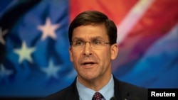 FILE - U.S. Defense Secretary Mark T. Esper delivers remarks before ringing the closing NASDAQ bell for Veterans Day in New York, New York, Nov. 11, 2019. 