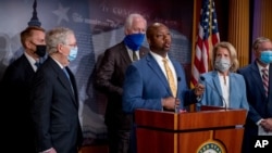 Sen. Tim Scott, R-S.C., center, accompanied by Senate Republicans, speaks at a news conference to announce a Republican police reform bill on Capitol Hill, June 17, 2020, in Washington.