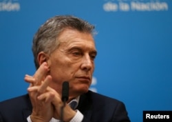 Argentina's President Mauricio Macri looks on during a news conference after the presidential primaries, in Buenos Aires, Argentina, Aug. 12, 2019.