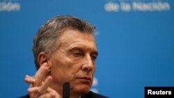 Argentina's President Mauricio Macri looks on during a news conference after the presidential primaries, in Buenos Aires, Argentina, Aug. 12, 2019. 