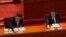 Chinese President Xi Jinping, left, and his Premier Li Keqiang cast their vote during the closing session of the National People's Congress (NPC) at the Great Hall of the People in Beijing, Thursday, March 11, 2021. China's ceremonial legislature on…
