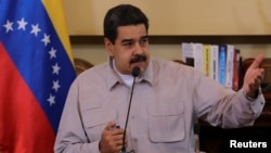 Venezuela's President Nicolas Maduro speaks during a meeting with ministers and pro-government governors in Caracas, Sept. 25, 2017. 