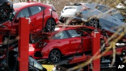 New Honda cars leave the Honda car plant in Swindon, western England, Feb. 19, 2019. 