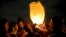 Iranians release a lit lantern during a celebration, known as "Chaharshanbe Souri," or Wednesday Feast, March 19, 2019, marking the eve of the last Wednesday of the solar Persian year, in Tehran.