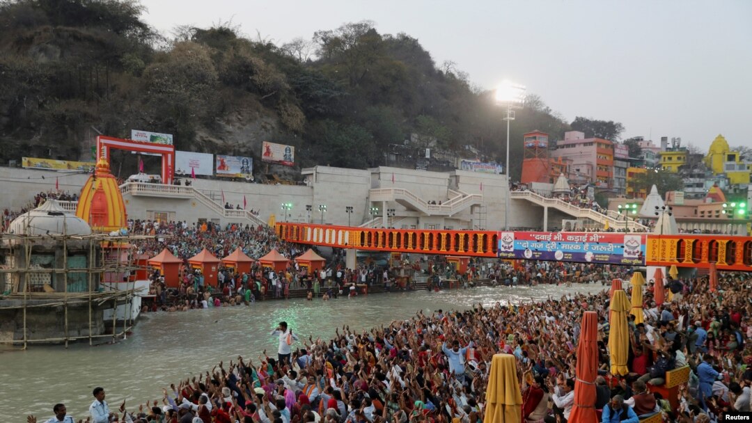 Devotees gather on the banks of Ganges river to pray ahead of the first Shahi Snan at "Kumbh Mela" or the Pitcher Festival, in Haridwar, India, March 10, 2021.