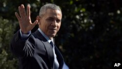 FILE - President Barack Obama waves as he walks toward Marine One on the South Lawn of the White House in Washington, before a short trip to Andrews Air Force Base, Md.