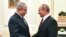 FILE - Russian President Vladimir Putin, right, shakes hands with Israeli Prime Minister Benjamin Netanyahu during their meeting at the Kremlin in Moscow, July 11, 2018.