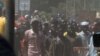 Des Burkinabè, lors des manifestations qui conduit à la chute de l'ex-président Blaise Compaoré, le 30 octobre 2014, à Ouagadougu, Burkina Faso.