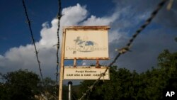 FILE - A sign outside Christian Aid Ministries, which had 17 of its members kidnapped, is seen in in Titanyen, Haiti, Oct. 21, 2021. 