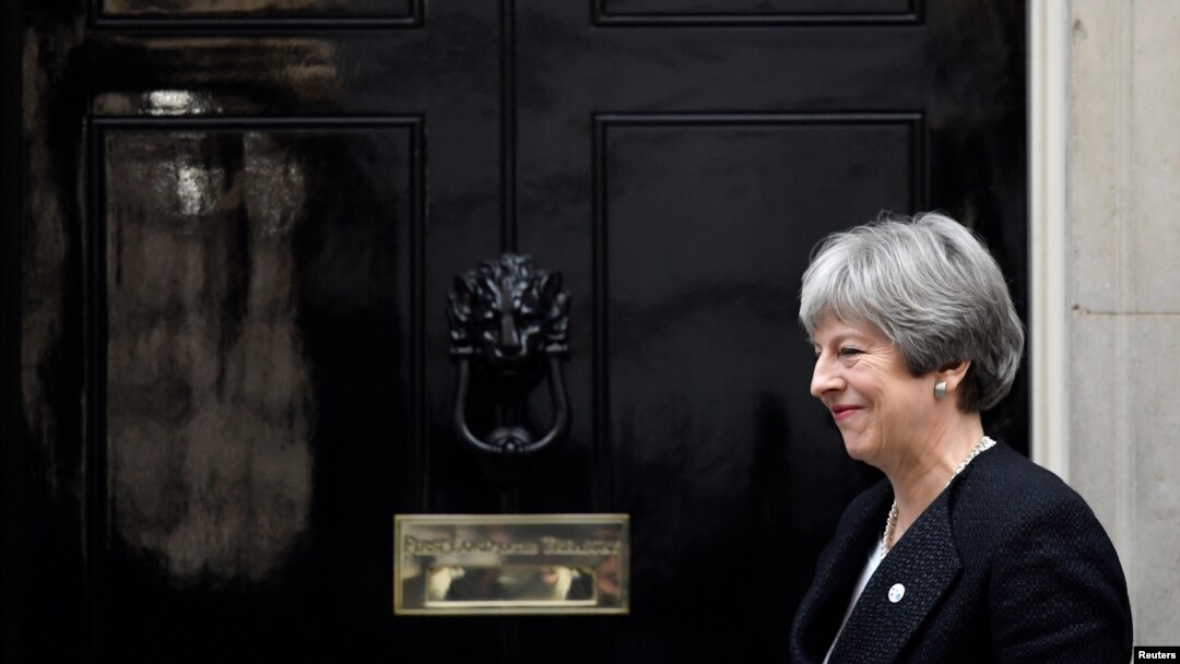 Britain's Prime Minister Theresa May walks out of 10 Downing Street in London, Jan. 30, 2018.