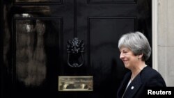 Britain's Prime Minister Theresa May walks out of 10 Downing Street in London, Jan. 30, 2018.