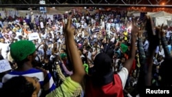 FILE - Sudanese protesters attend a demonstration along the streets of Khartoum, May 22, 2019.