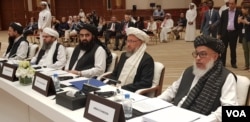 FILE - Members of the Taliban political office are seen at the start of an intra-Afghan dialogue session, in Doha, Qatar, July 7, 2019. (A. Tanzeem/VOA)