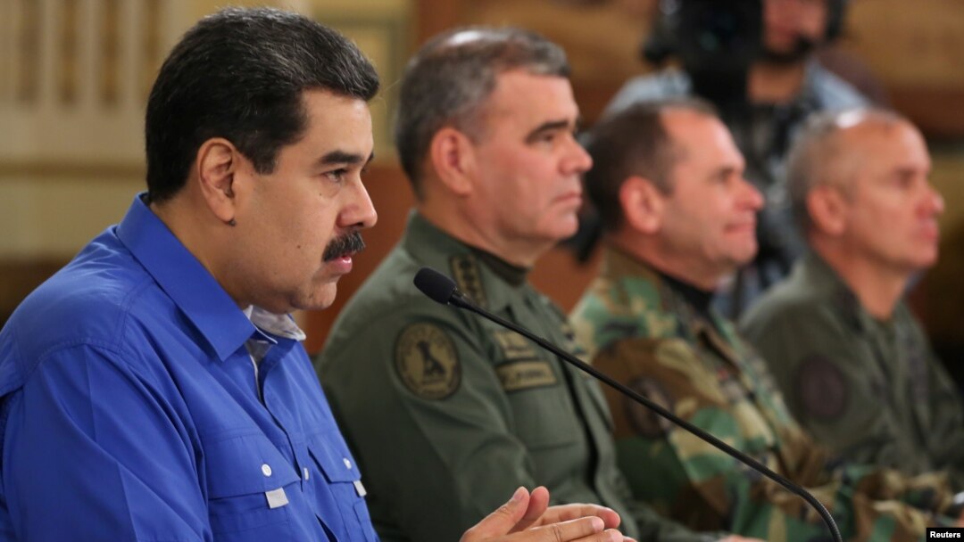 FILE - Venezuela's President Nicolas Maduro speaks during a broadcast with members of the government and military high command members at Miraflores Palace in Caracas, April 30, 2019. (Miraflores Palace handout via Reuters) 